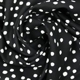 Twill de viscose imprimé à pois blanc fond noir