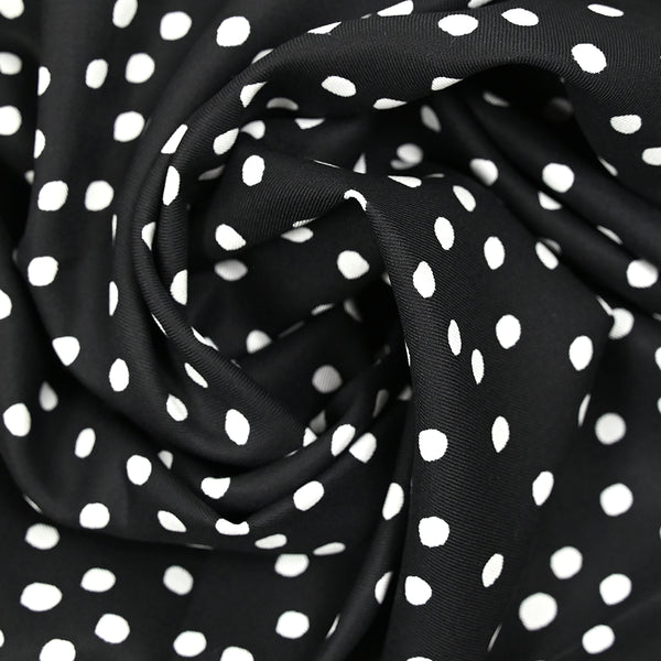 Twill de viscose imprimé à pois blanc fond noir