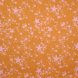 Coton imprimé élasthanne étoile rose pâle fond cannelle