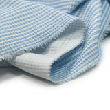 Maille jacquard petits rectangles bleu ciel fond blanc