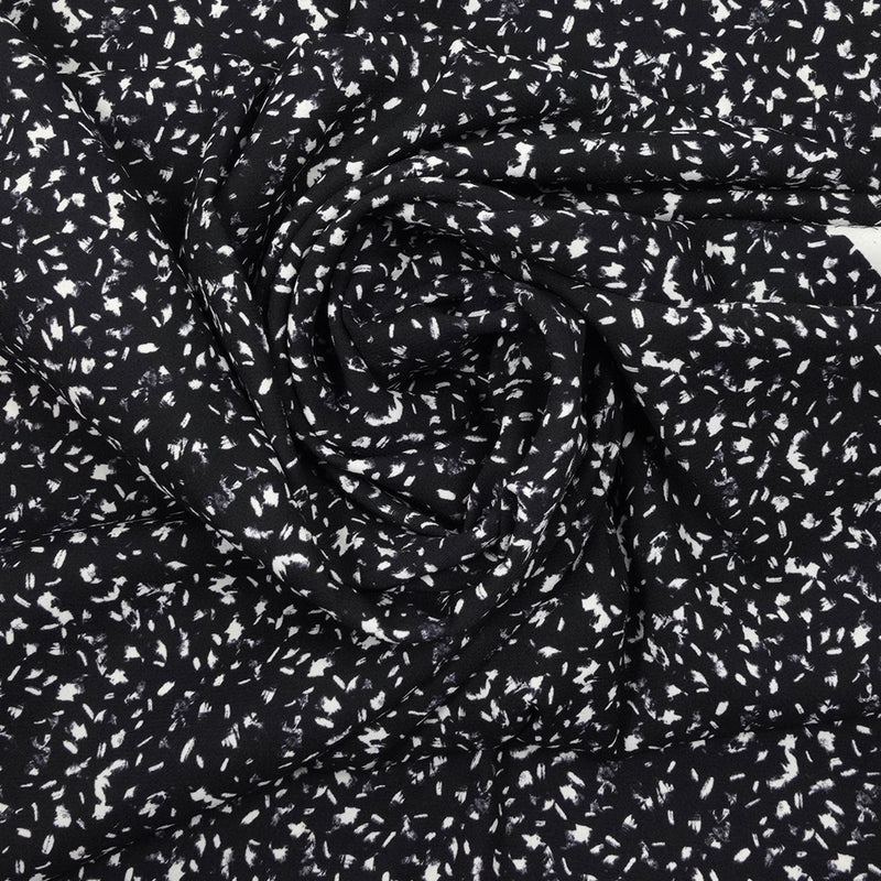 Crêpe polyester imprimé graphique taches blanches fond noir