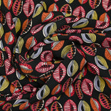 Polyester imprimé graines de bisous fond noir