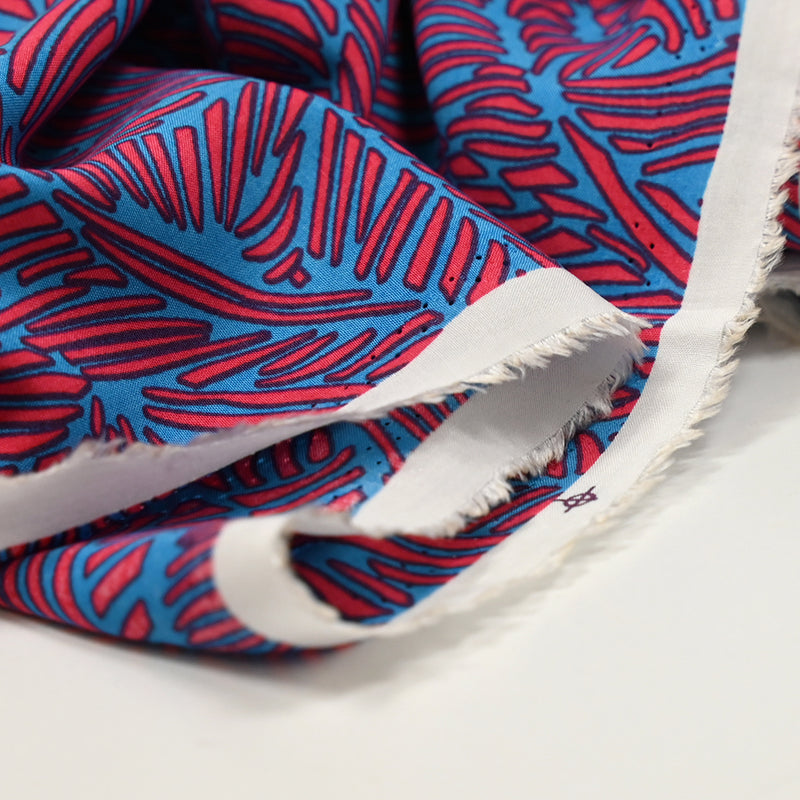 Viscose imprimée fougères orange corail et bleu