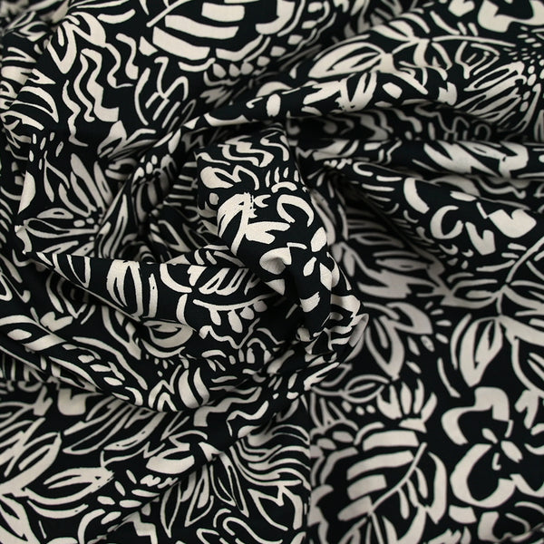 Coton imprimé croquis fleurs blanc fond noir