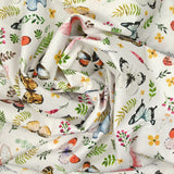 Coton imprimé papillons multicolore fond blanc