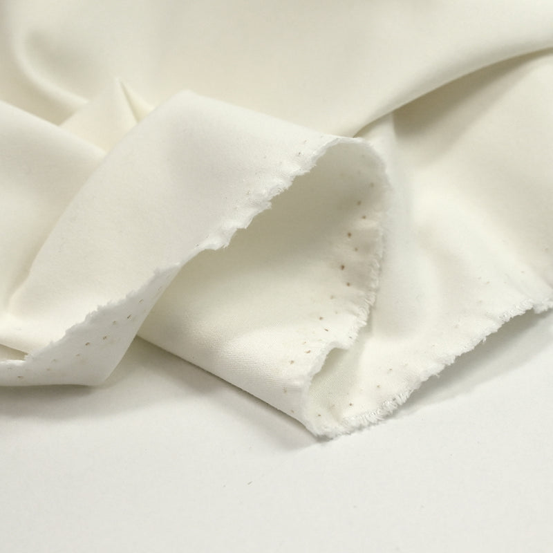 Maille milano polyester blanc cassé