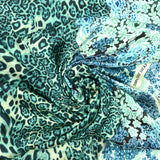 Satin fin polyester imprimé léopard et fleurs turquoise