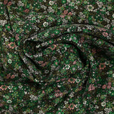 Twill de viscose imprimé rêverie vert et rose fond noir