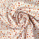 Coton imprimé au gré du vent orange fond blanc