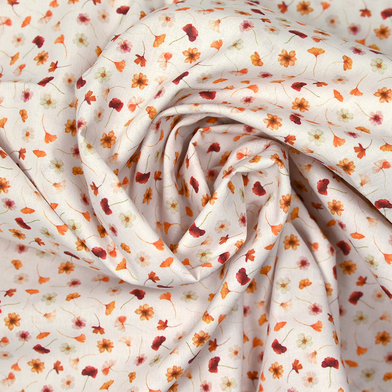 Coton imprimé au gré du vent orange fond blanc