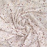 Coton imprimé ouragan floral marron fond blanc