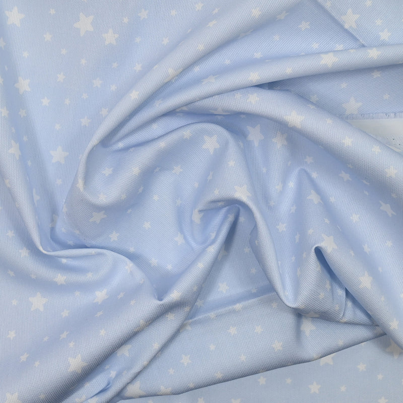 Piqué de coton imprimé étoiles fond bleu clair