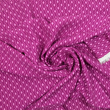 Viscose imprimée étincelle rose fond lie de vin