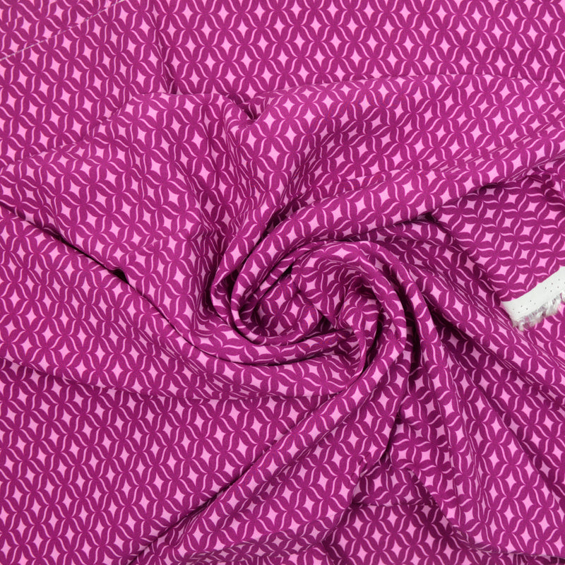 Viscose imprimée étincelle rose fond lie de vin