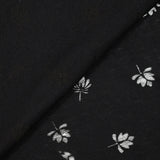 Jersey de coton fin ajouré feuilles fond noir