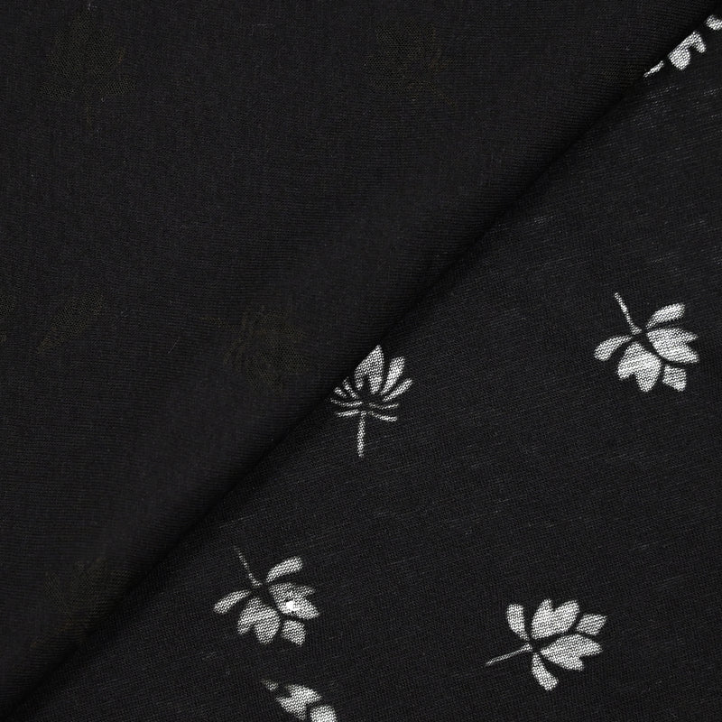 Jersey de coton fin ajouré feuilles fond noir
