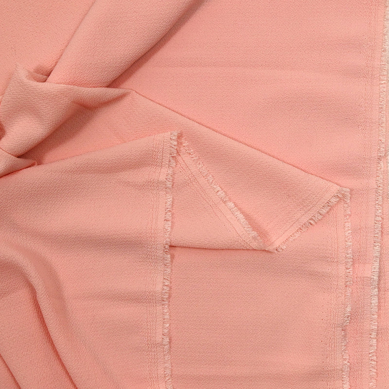 Pale pink polyester crepe