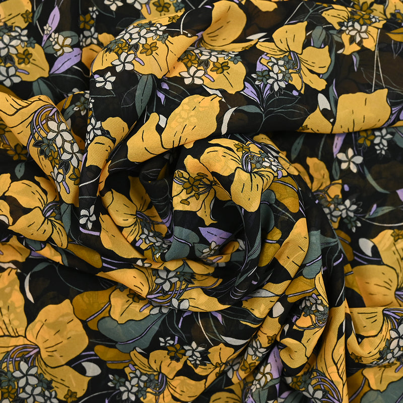 Mousseline de polyester imprimée fleurs jaune et vert fond noir