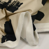 Coton élasthanne imprimé pinceaux noir fond beige