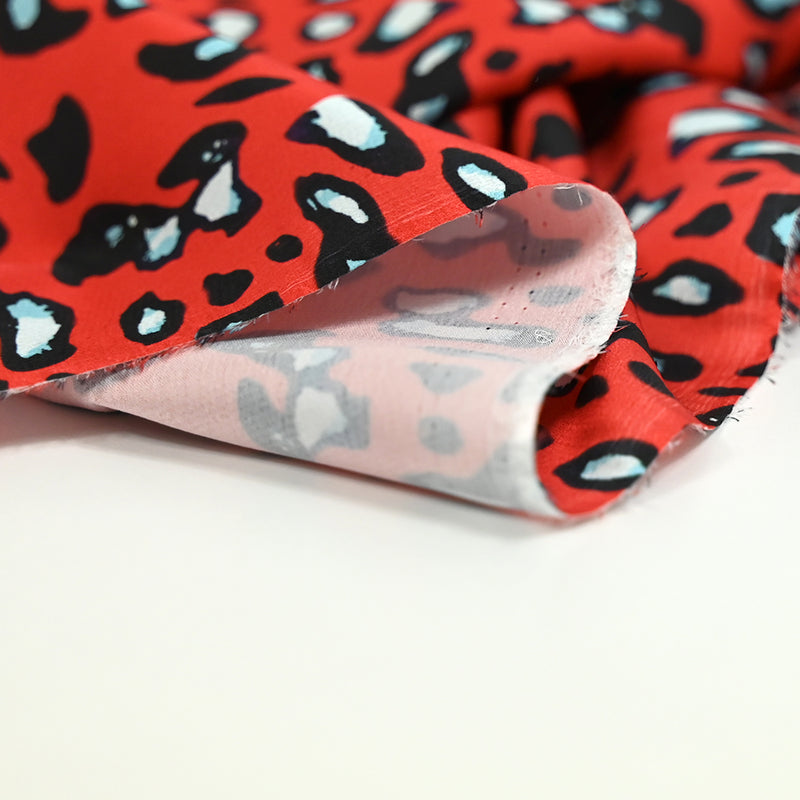 Crêpe satin polyester printed safari red background