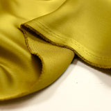 Crêpe satin polyester chartreuse doré
