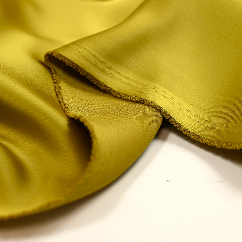 Crêpe satin polyester chartreuse doré