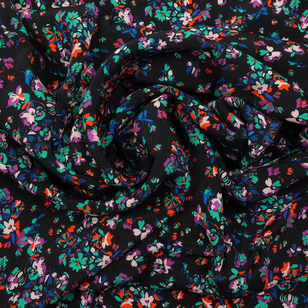 Crêpe viscose imprimé fleurs éclatantes vertes et orange fond noir