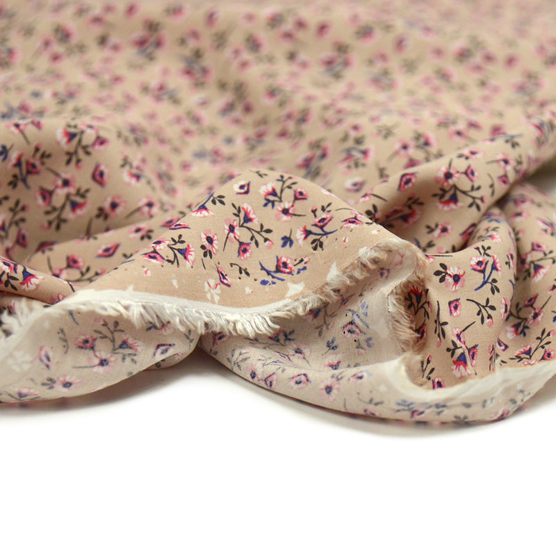 Viscose imprimée petites fleurs rose et violet fond beige