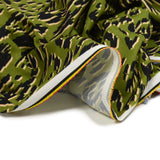 Polyester imprimé texturé savane beige et noir fond vert mousse