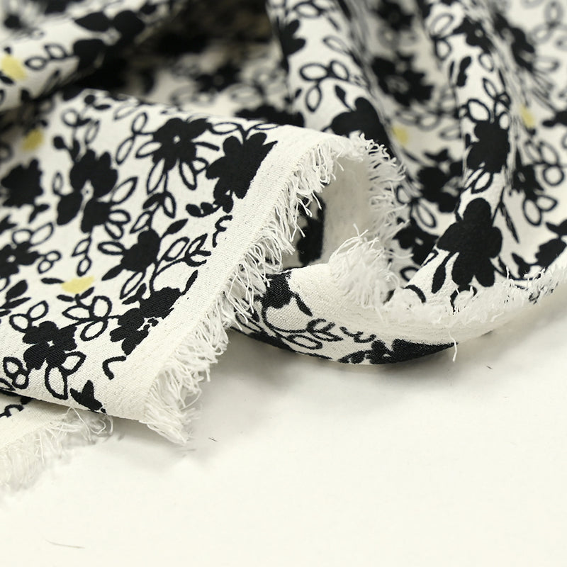Crêpe polyester imprimé fleurs noires fond blanc