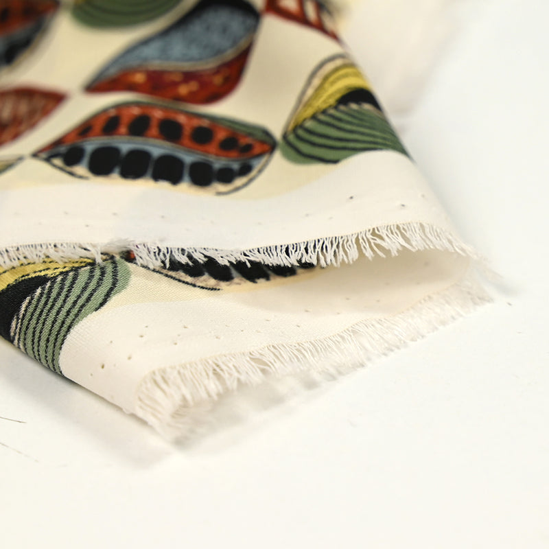 Polyester imprimé graines de bisous fond écru