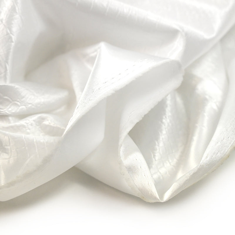 Satin polyester effet reptile blanc