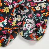 Crépon polyester fleuri multicolore fond noir