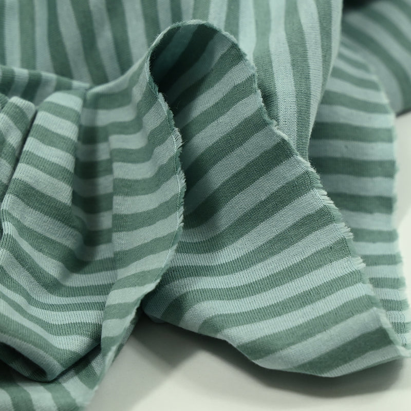 Green greenery and pale blue striped cotton jersey