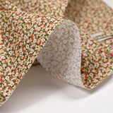 Printed cotton blossoming green, red and beige