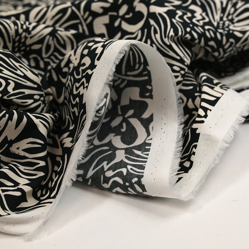 Coton imprimé croquis fleurs blanc fond noir
