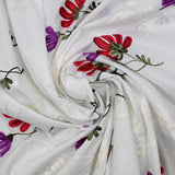 Embroidered cotton sail and plumetis luz broken white background