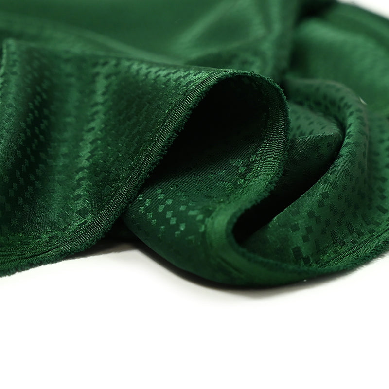 Satin jacquard de polyester Zoé fond vert bouteille