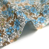 Popeline de coton imprimée printemps des fleurs bleu et beige