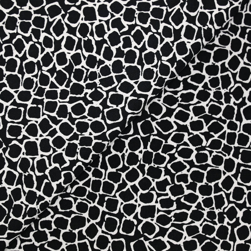 Jersey polyester écailles fond noir