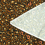 Viscose jersey printed leopard ocher brown background