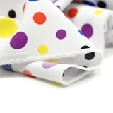 Tissu carnaval polyester pois multicolore fond blanc