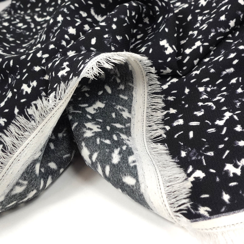 Crêpe polyester imprimé graphique taches blanches fond noir