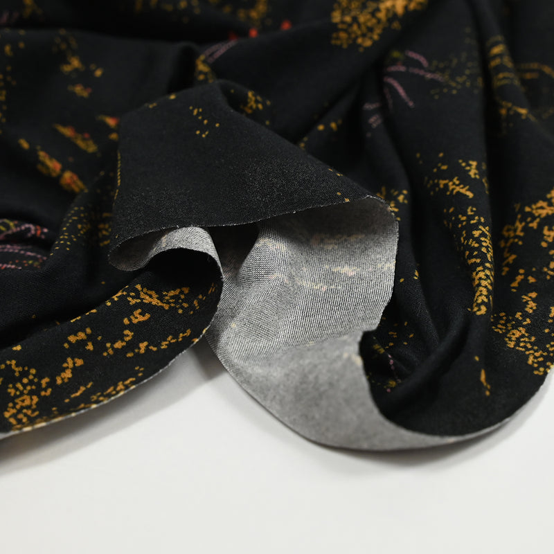 Jersey de polyester imprimé pointillisme fond noir