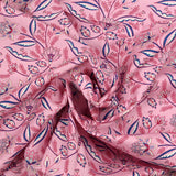 Coton imprimé éclosion de fleurs fond rose