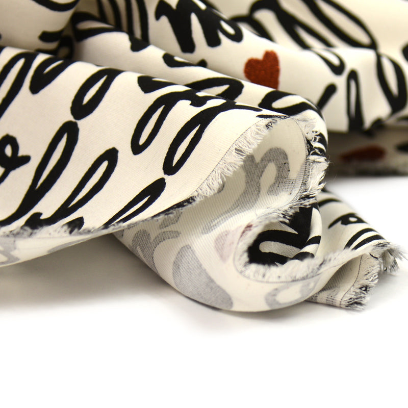 Toile de coton chevron imprimé hello fond banc cassé