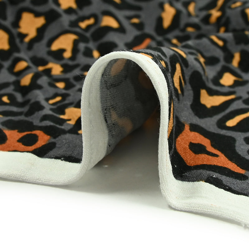 Viscose jersey printed leopard ocher bluish gray background