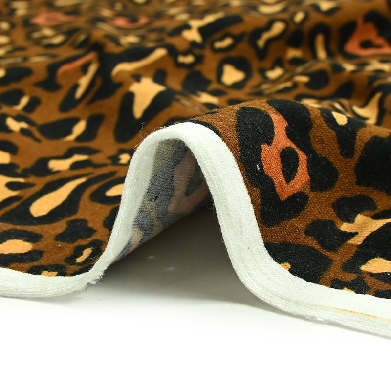 Viscose jersey printed leopard ocher brown background