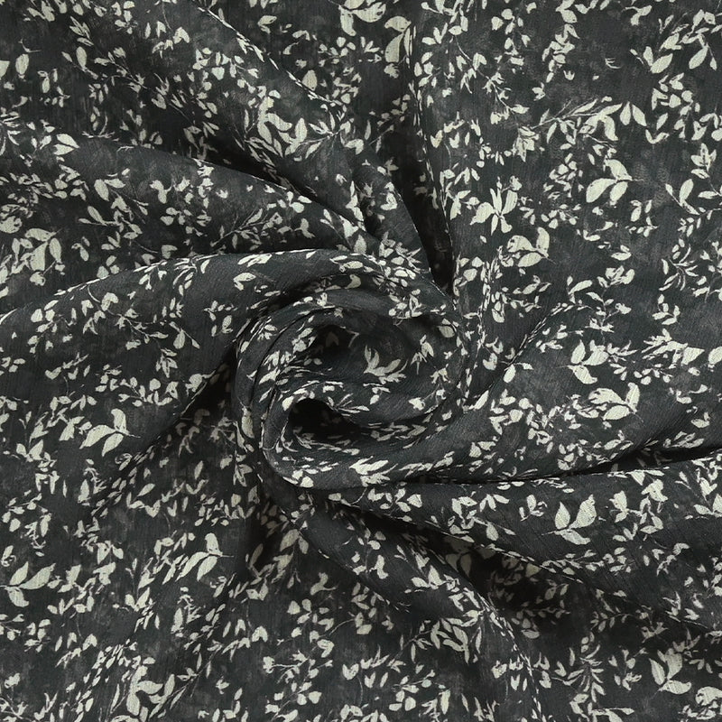 Mousseline imprimée branches et feuillage fond noir