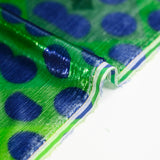Velours de polyester Lurex imprimé grand pois bleu fond vert